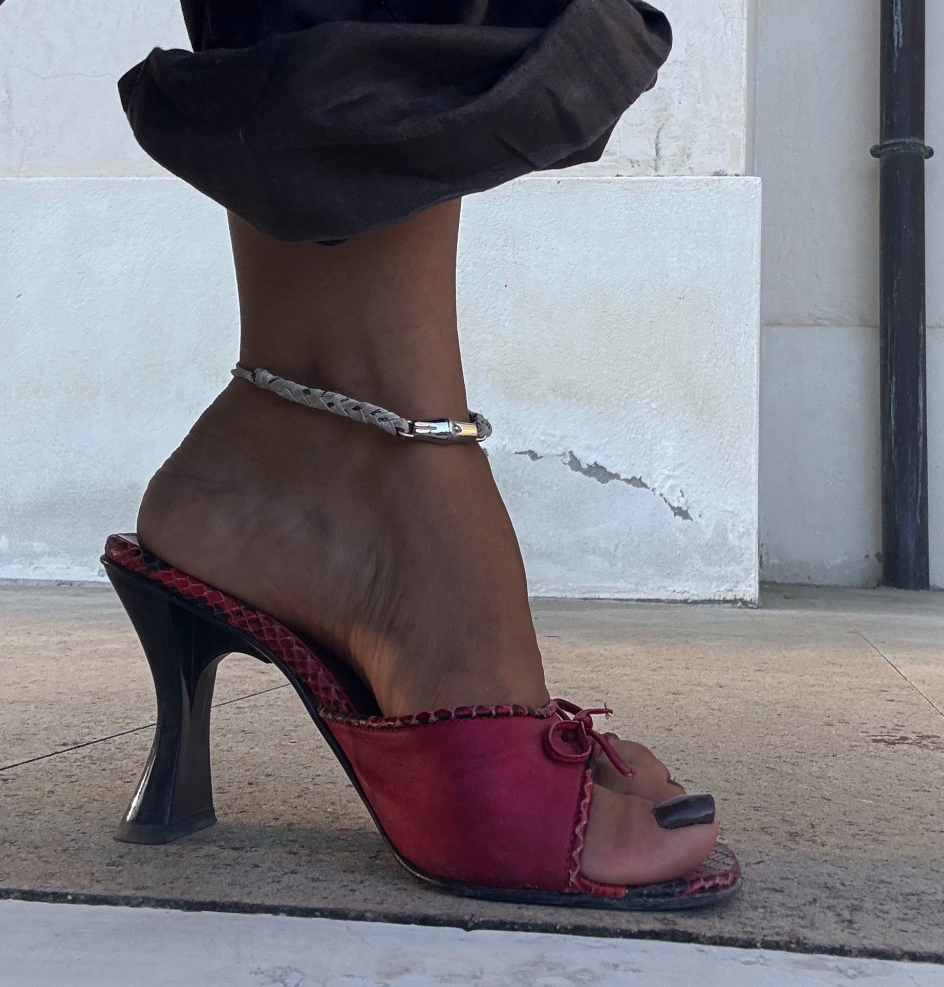 Red fiocchetto mules