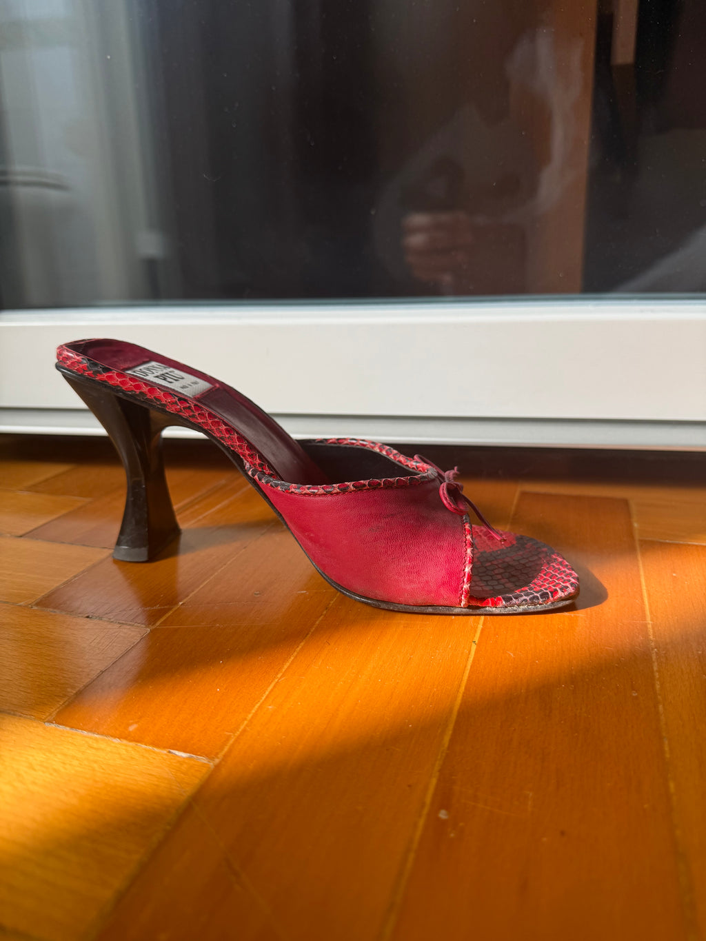 Red fiocchetto mules