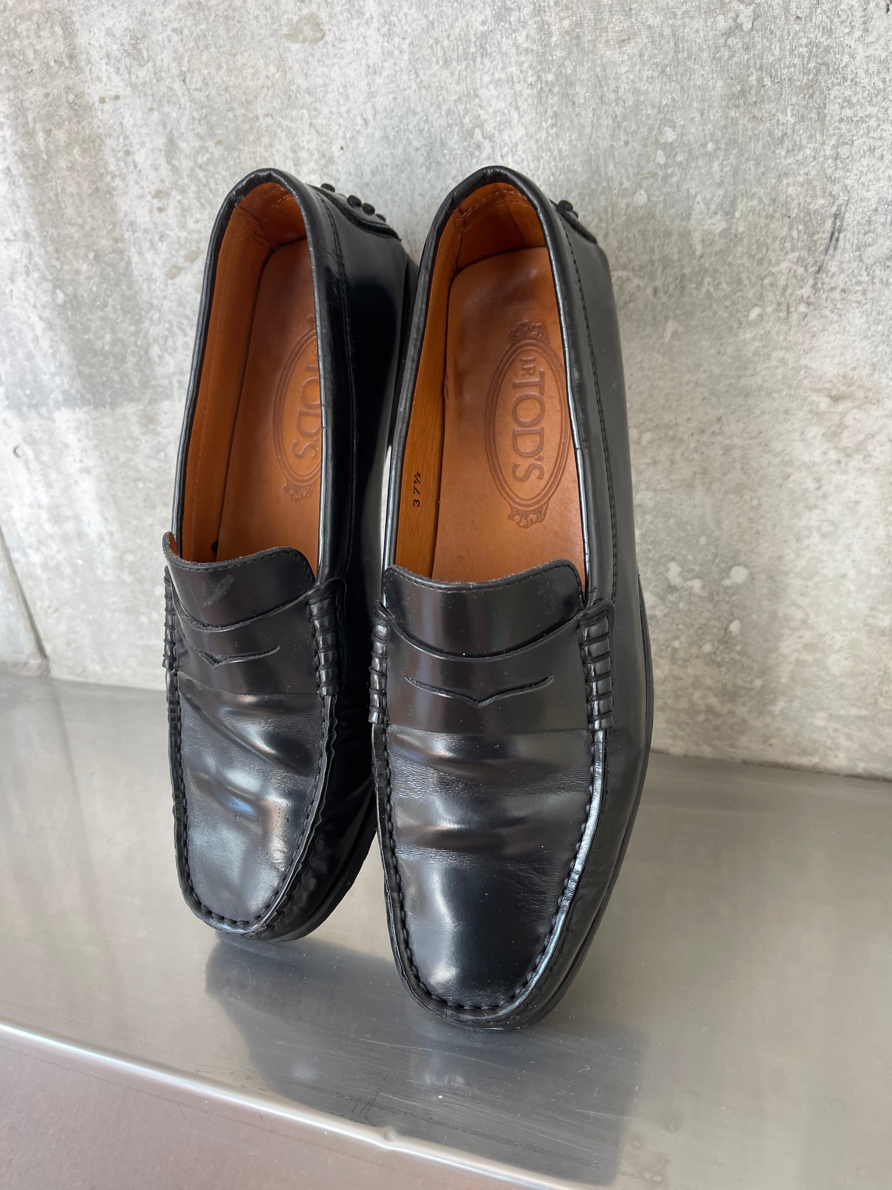 Tod’s black loafers