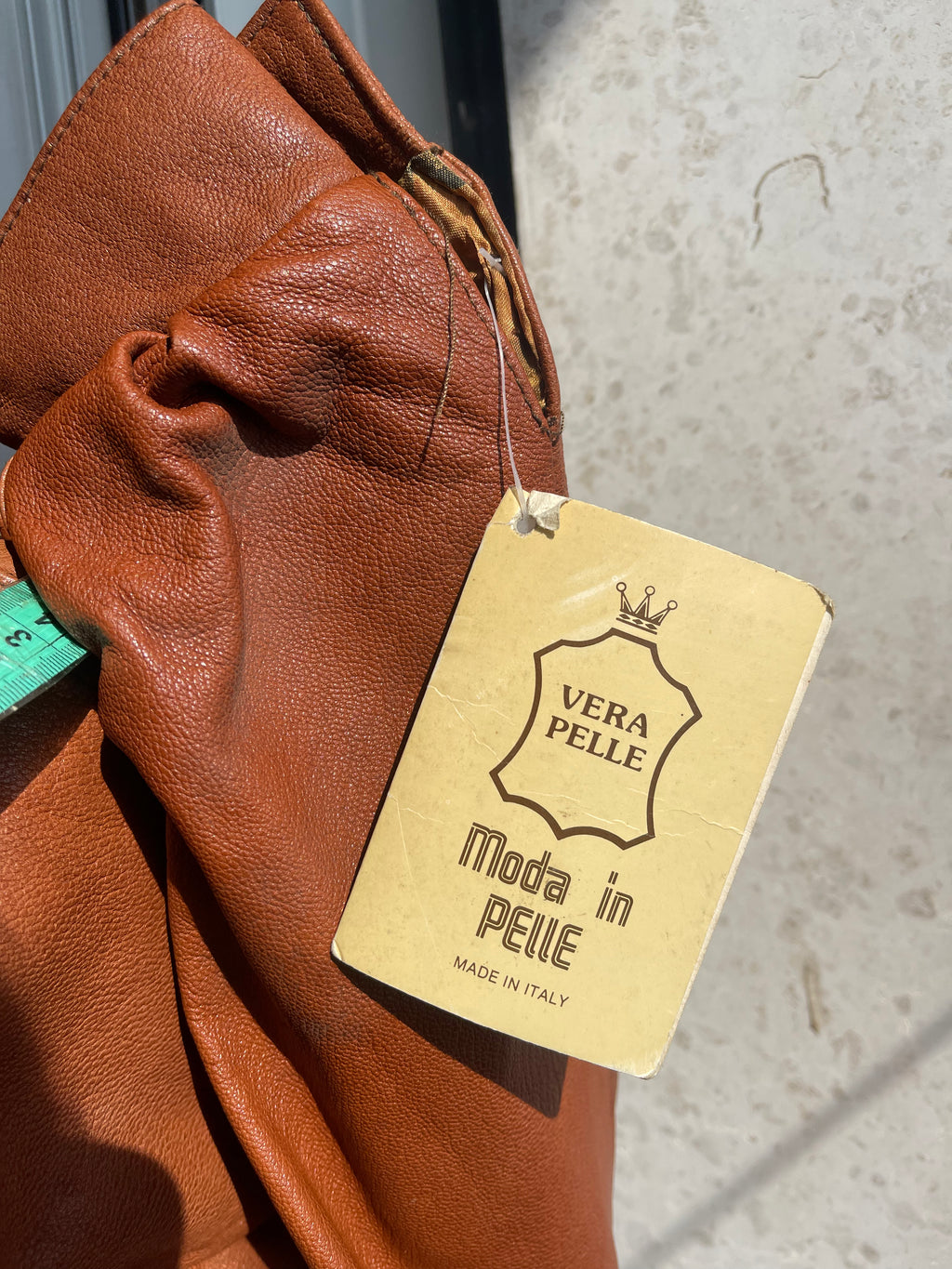 Cropped cognac leather jacket